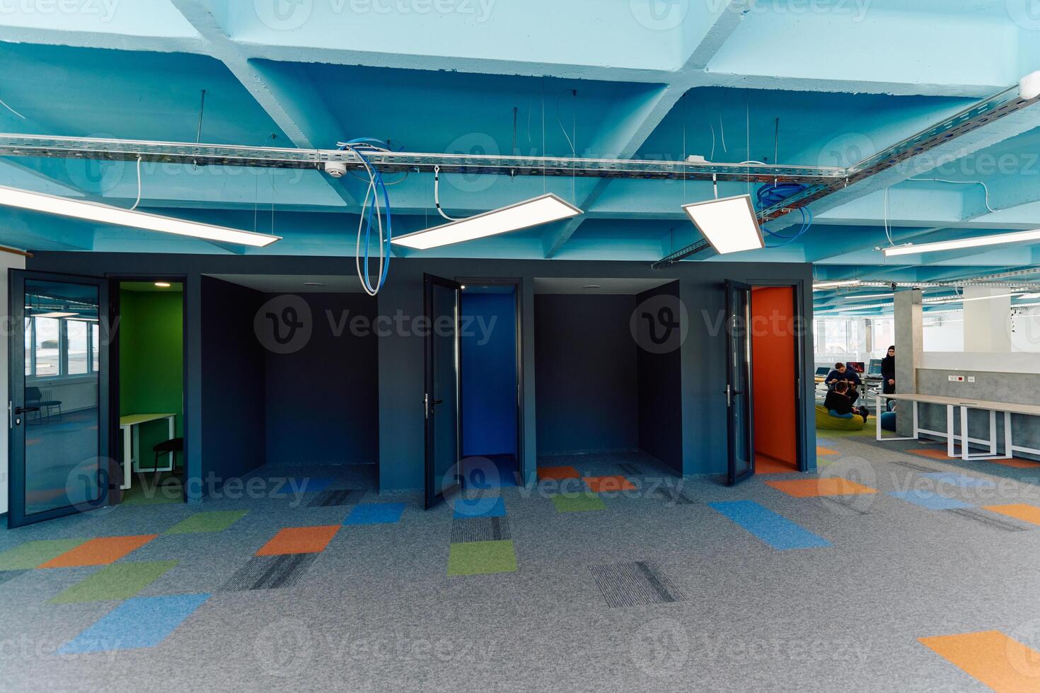 Photo of a modern office where programming, digital marketing and web design projects are done. Office with modern furniture and glass office