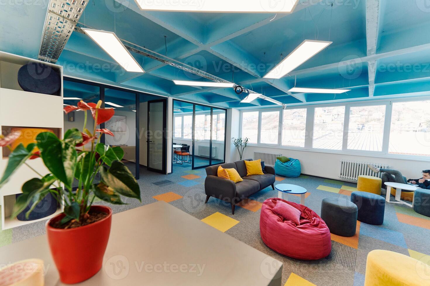 Photo of a modern office where programming, digital marketing and web design projects are done. Office with modern furniture and glass office