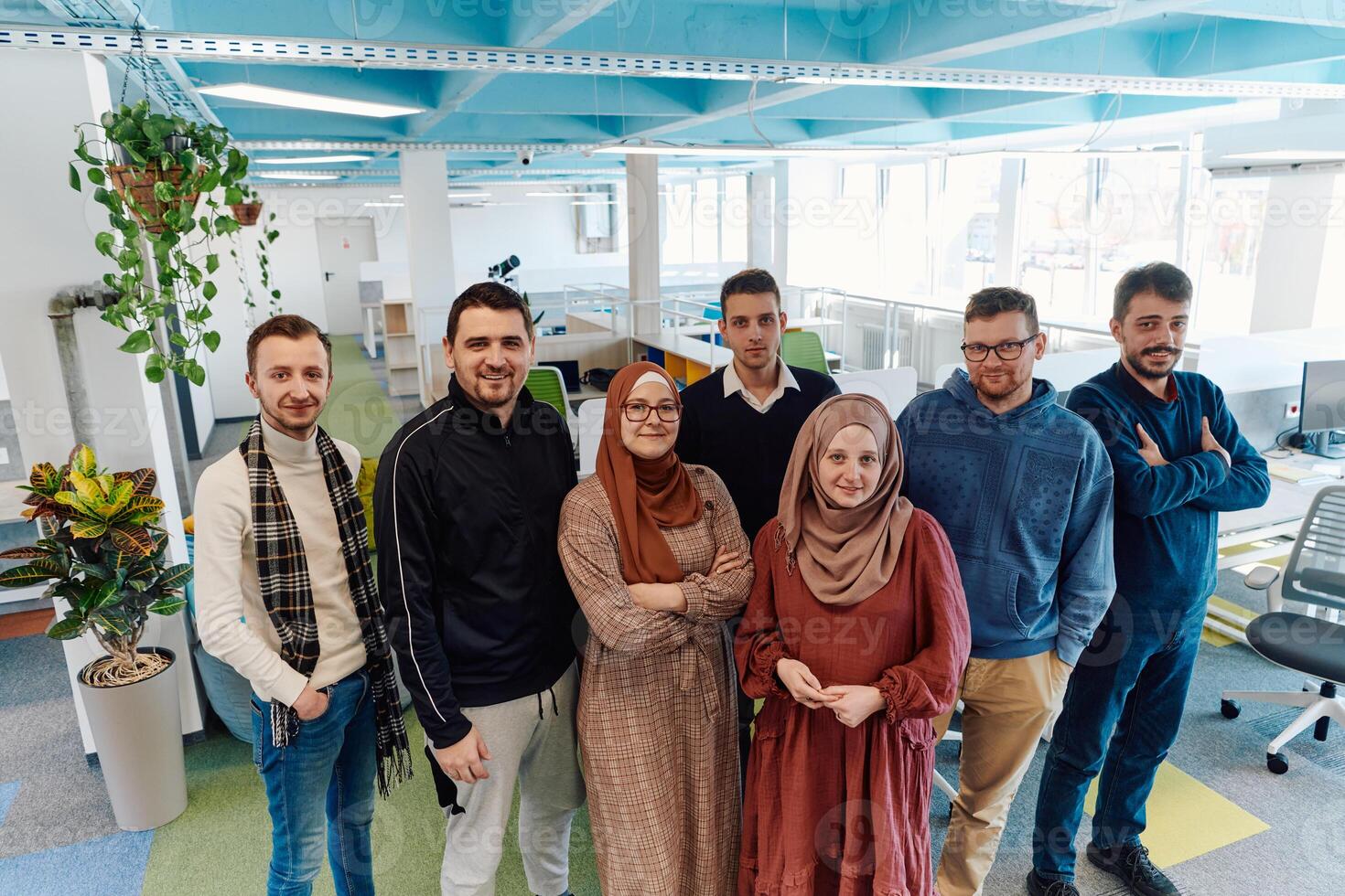 Portrait of a successful creative businessman and businesswoman looking at camera and smiling. Diverse business people standing together at startup. photo