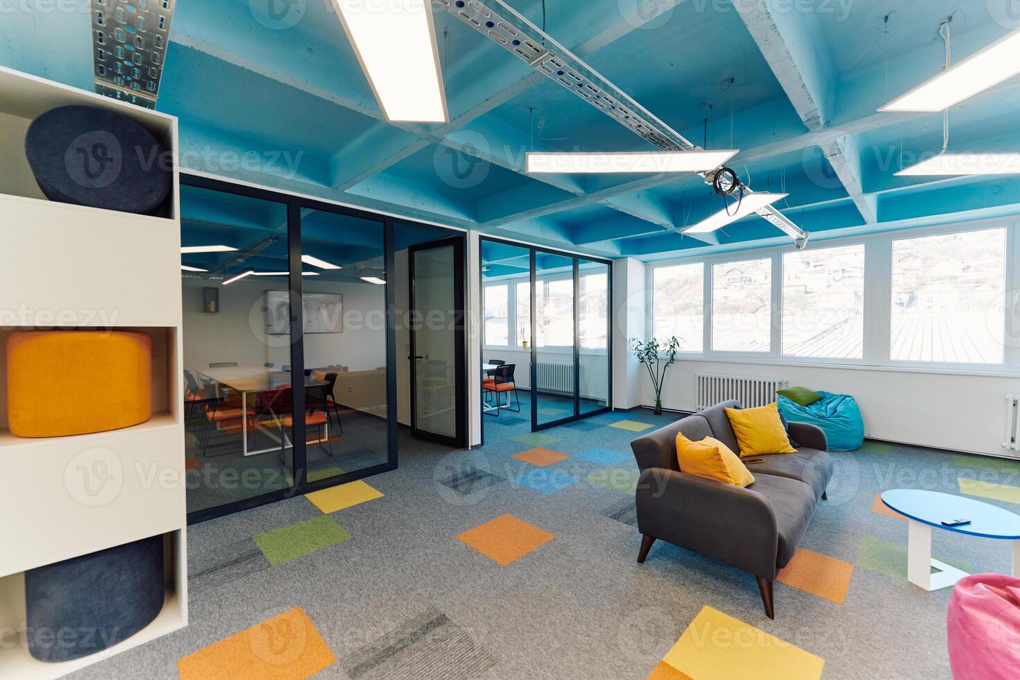 Photo of a modern office where programming, digital marketing and web design projects are done. Office with modern furniture and glass office