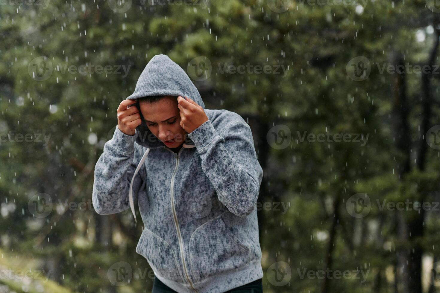 Beautiful Woman Enjoying Rainy Day After Intense Run photo