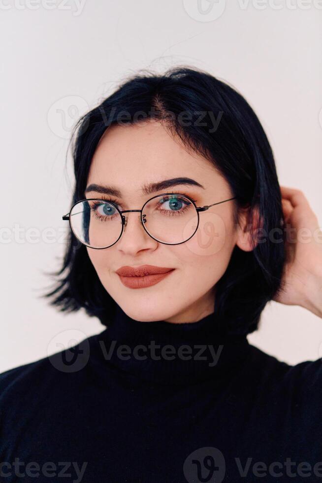 Smiling Brunette Woman Wearing Eyeglasses Poses on White Background photo