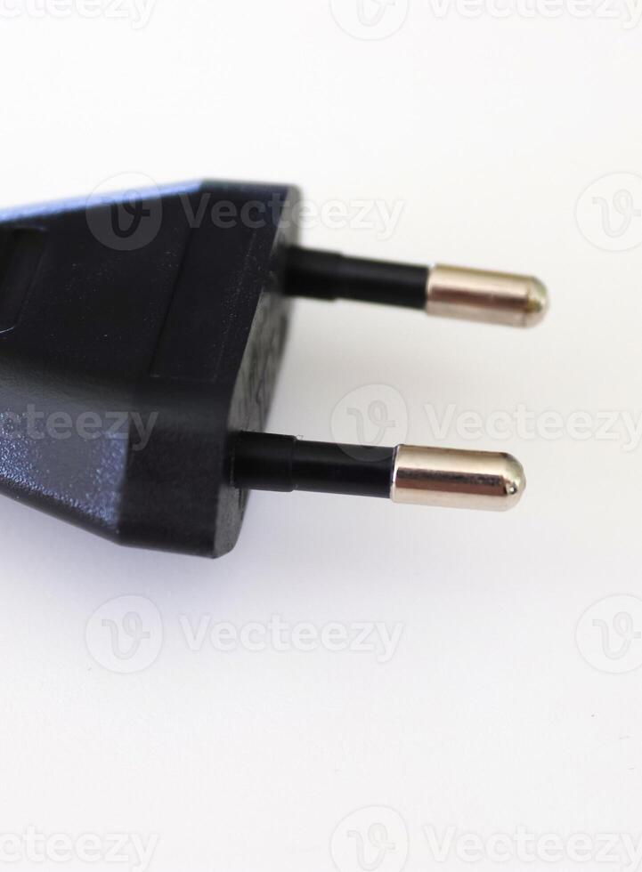Isolated electrical black and white european plugs on a white background photo