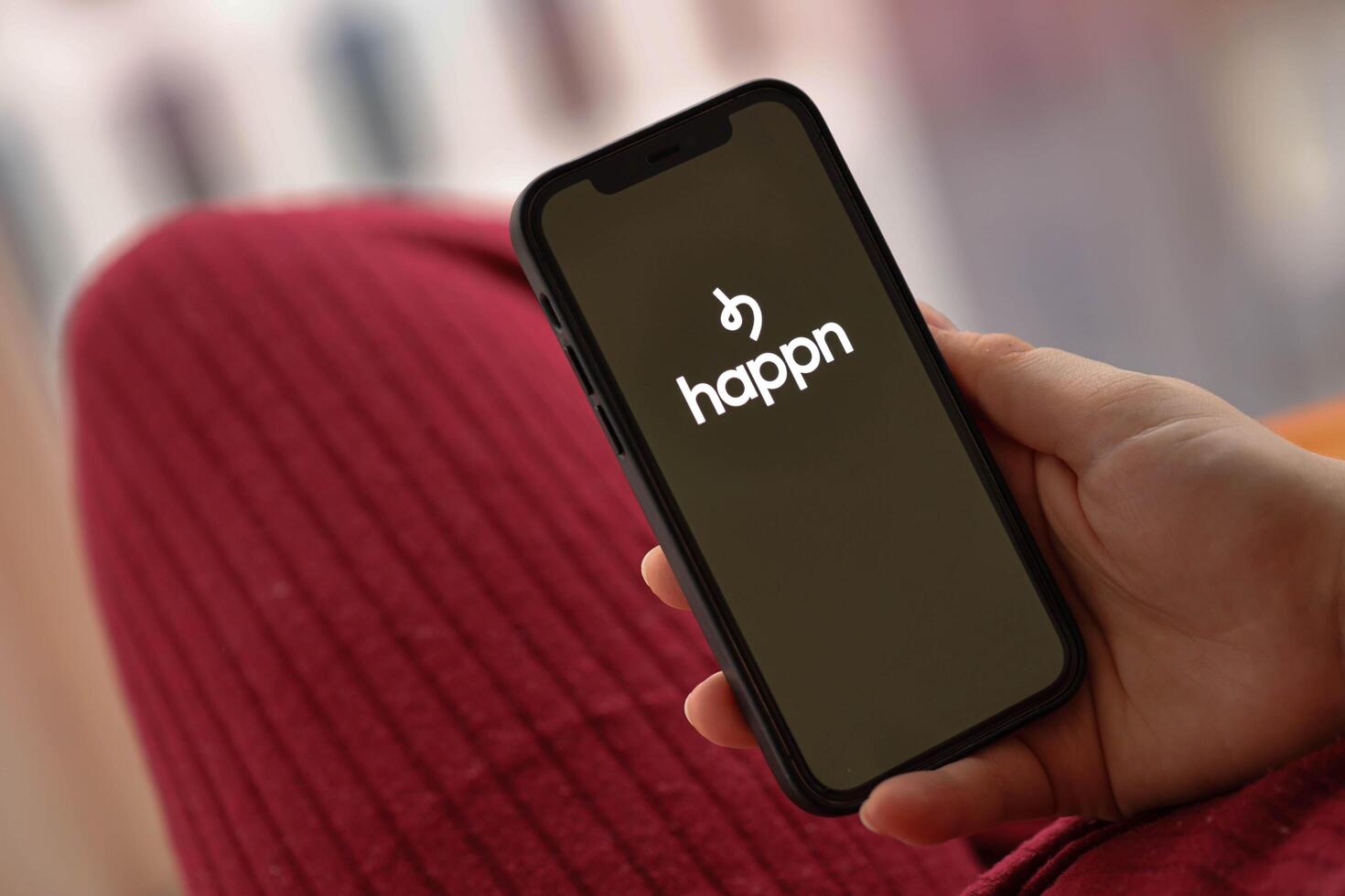 KYIV, UKRAINE - FEBRUARY 23, 2024 Happn logo of famous dating website or app on iPhone display photo