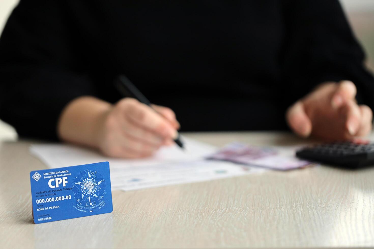 KYIV, UKRAINE - OCTOBER 31, 2023 Blue CPF card document template. The document guarantees authenticity and integrity in electronic communication between people in Brazil photo