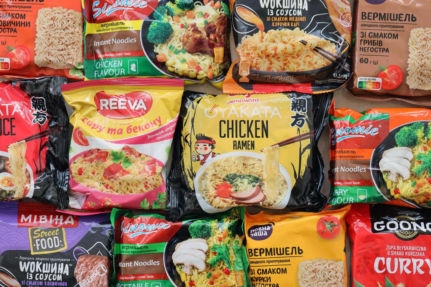 KYIV, UKRAINE - OCTOBER 31, 2023 Many packs of instant noodles for fast cooking by various brands and manufacturers photo