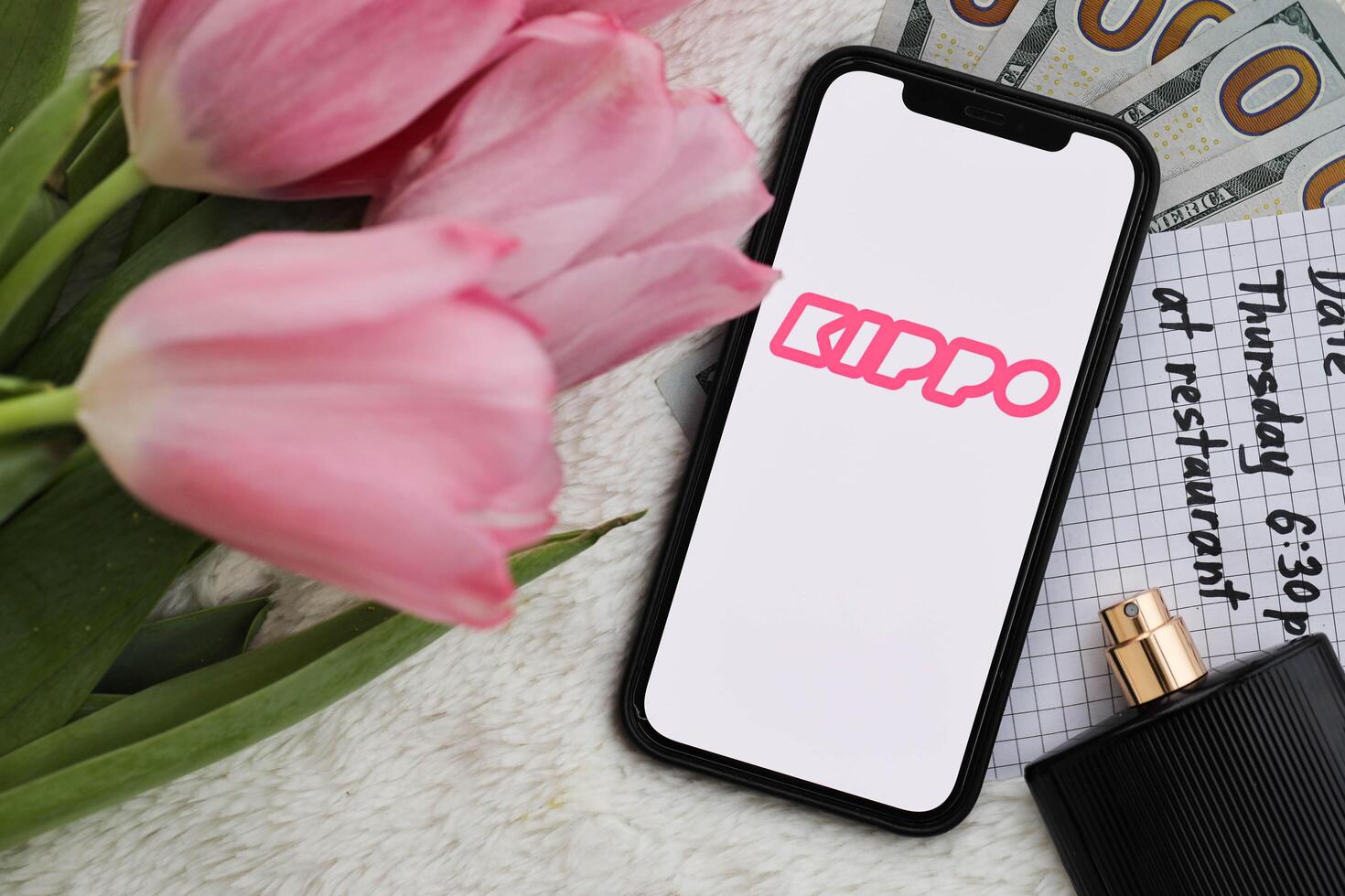 KYIV, UKRAINE - FEBRUARY 23, 2024 Kippo logo of famous dating website or app on iPhone display photo