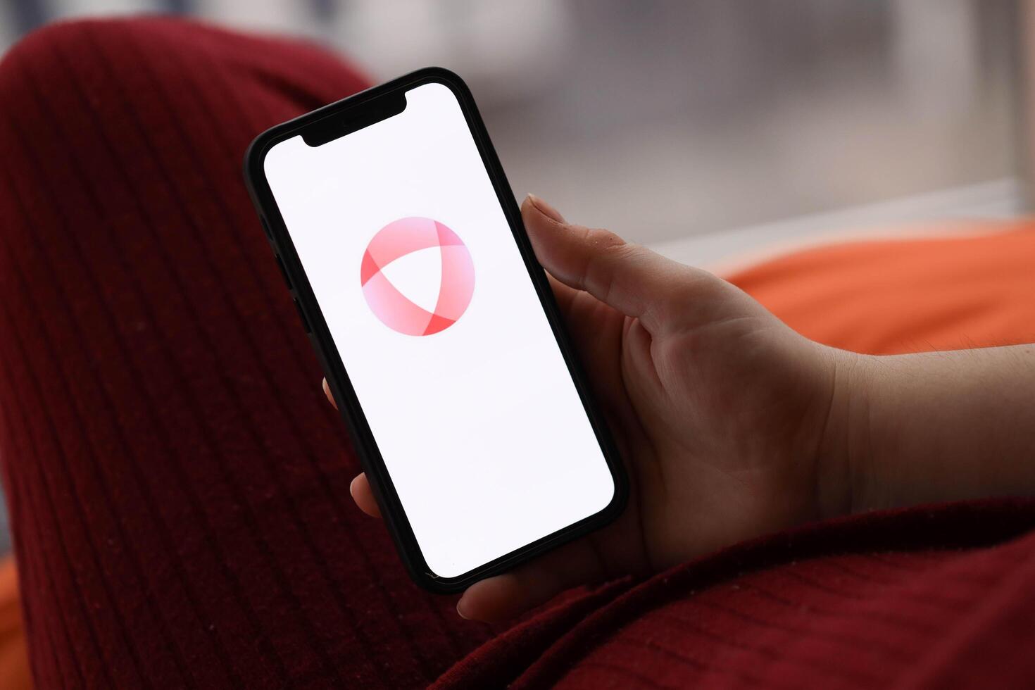 KYIV, UKRAINE - FEBRUARY 23, 2024 Open logo of famous dating website or app on iPhone display photo
