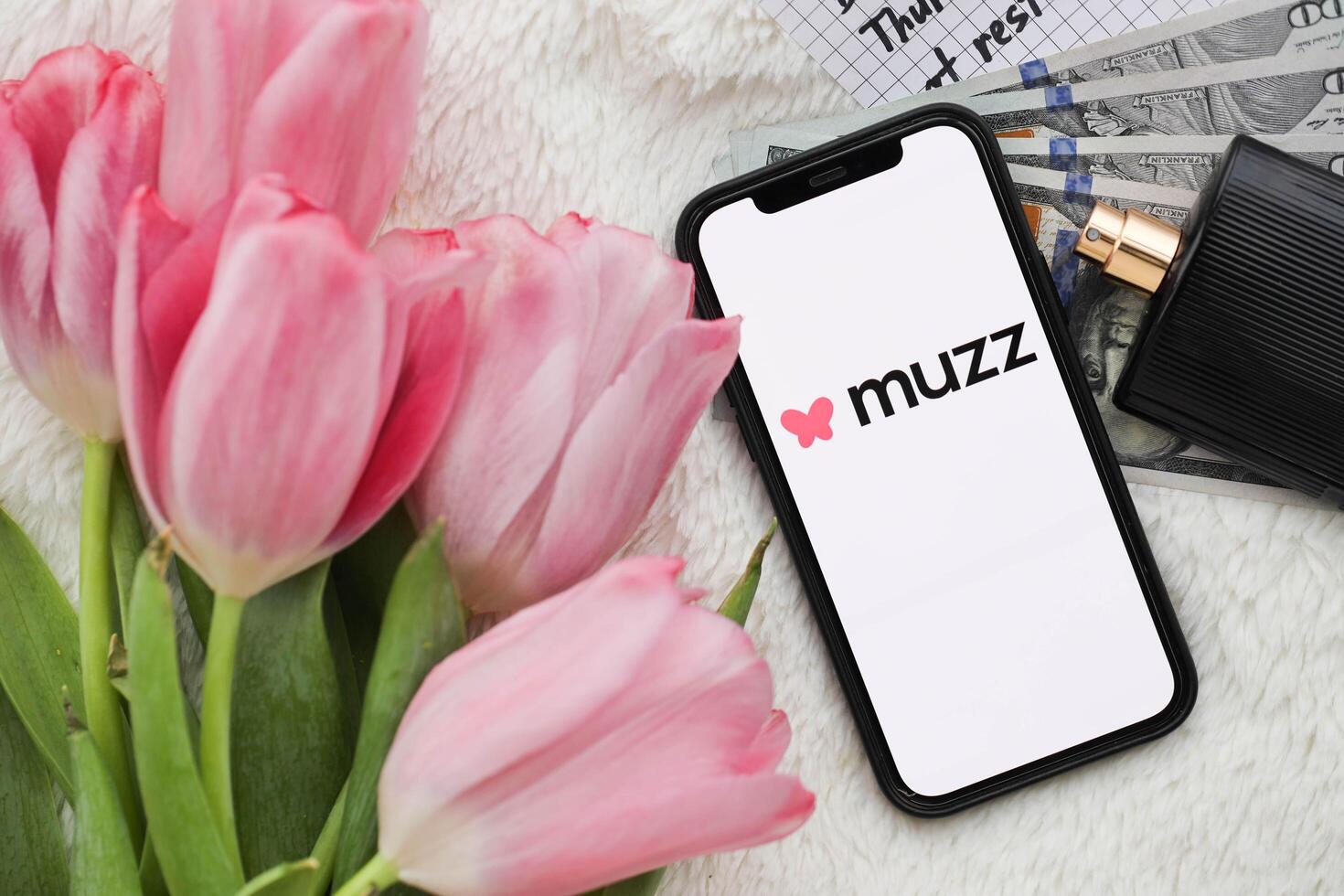 KYIV, UKRAINE - FEBRUARY 23, 2024 Muzz logo of famous dating website or app on iPhone display photo