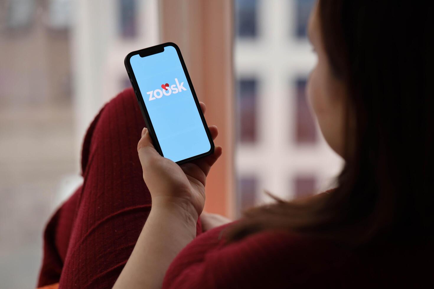 KYIV, UKRAINE - FEBRUARY 23, 2024 Zoosk logo of famous dating website or app on iPhone display photo