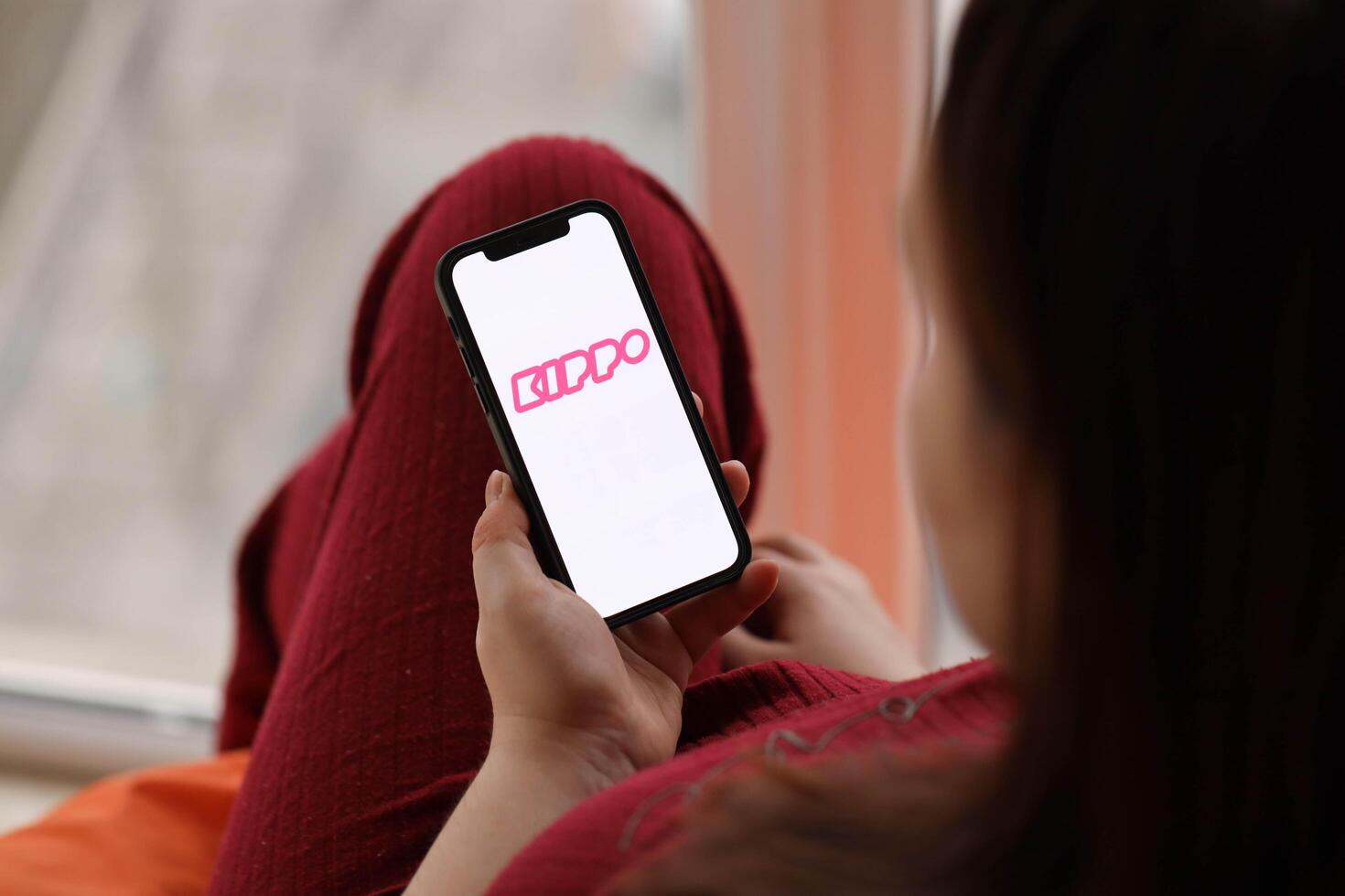 KYIV, UKRAINE - FEBRUARY 23, 2024 Kippo logo of famous dating website or app on iPhone display photo