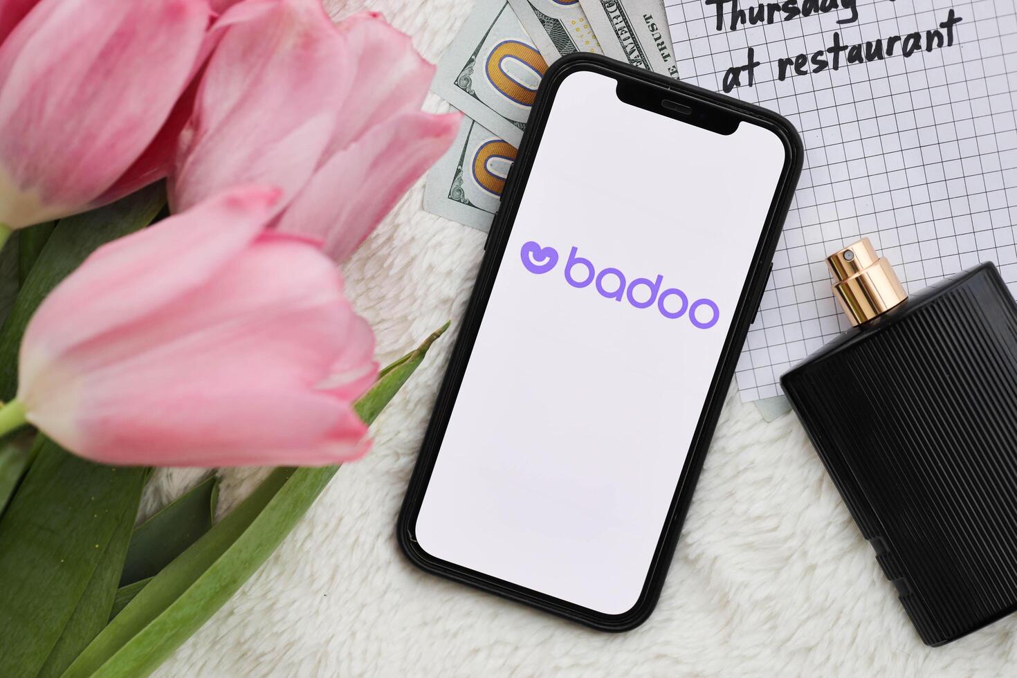 KYIV, UKRAINE - FEBRUARY 23, 2024 Badoo logo of famous dating website or app on iPhone display photo
