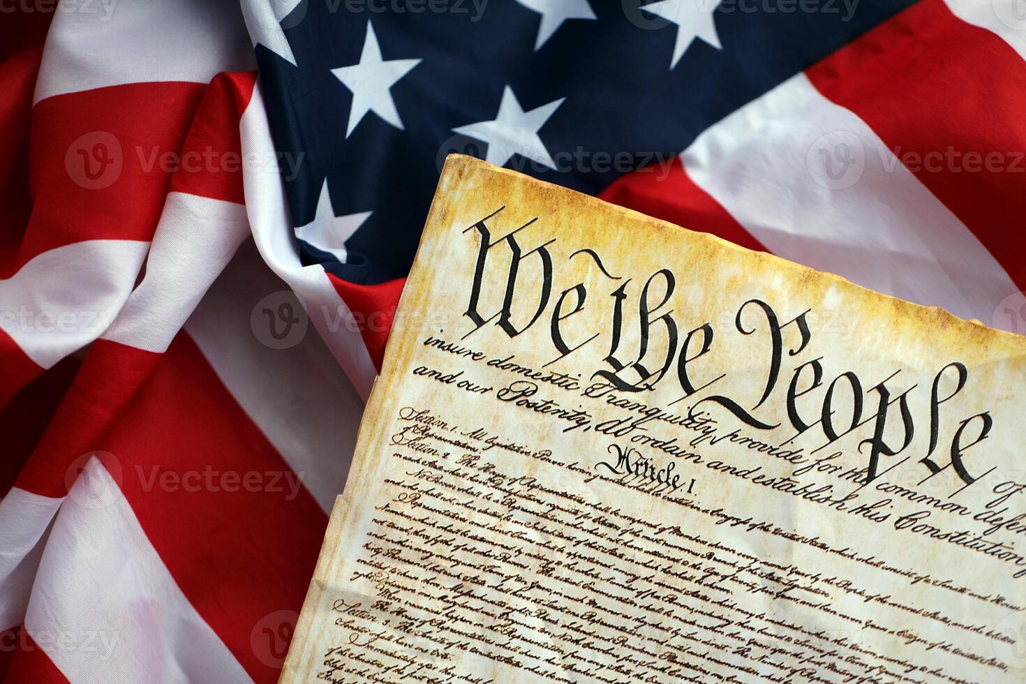 Preamble to the Constitution of the United States and American Flag close up photo