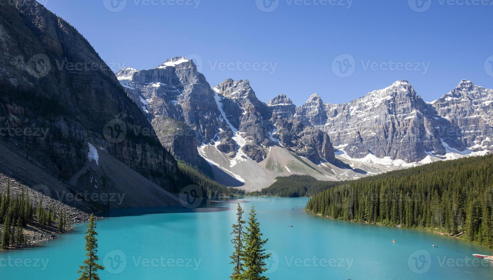 Majestic Mountains and Tranquil Waters of Lake Moraine in Summer photo