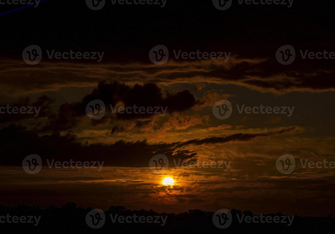 Sunset Through Dark Clouds photo