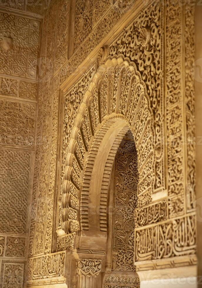 Intricate Carved Archway in the Alhambra Palace, Granada, Spain photo