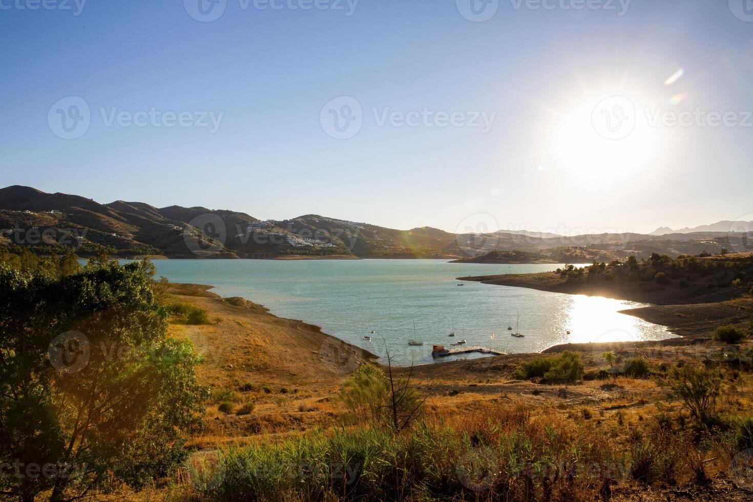Sunny Afternoon at a Tranquil Lake in the Spanish Mountains photo