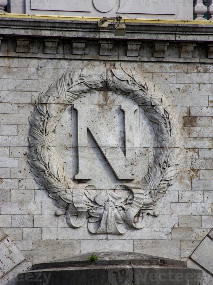 Stone Carving of the Letter N With Laurel Wreath on Building Facade in Paris photo