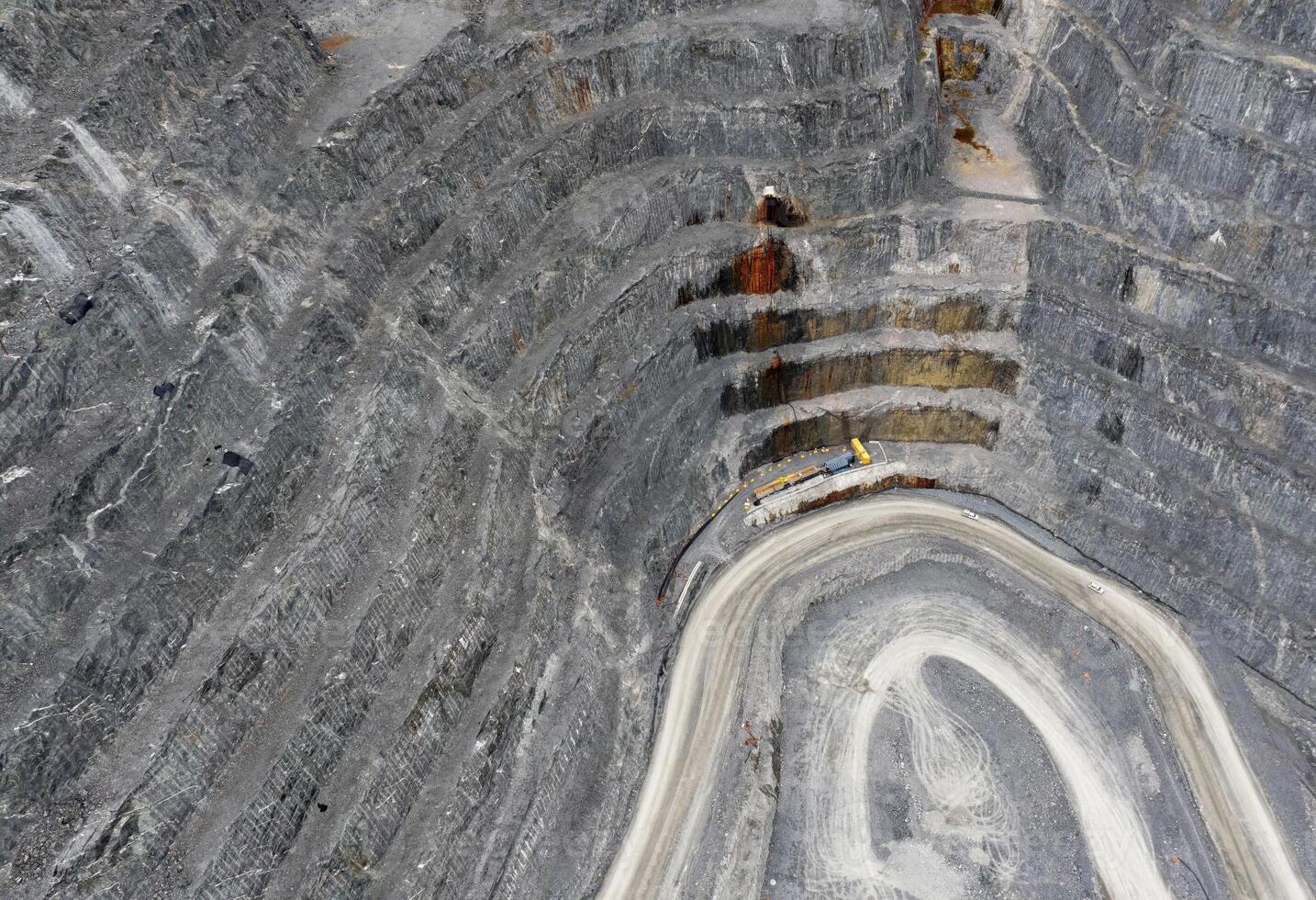 Aerial View of an Open-Pit Mine With a Winding Road in Abitibi-Temiscamingue, Quebec, Canada photo