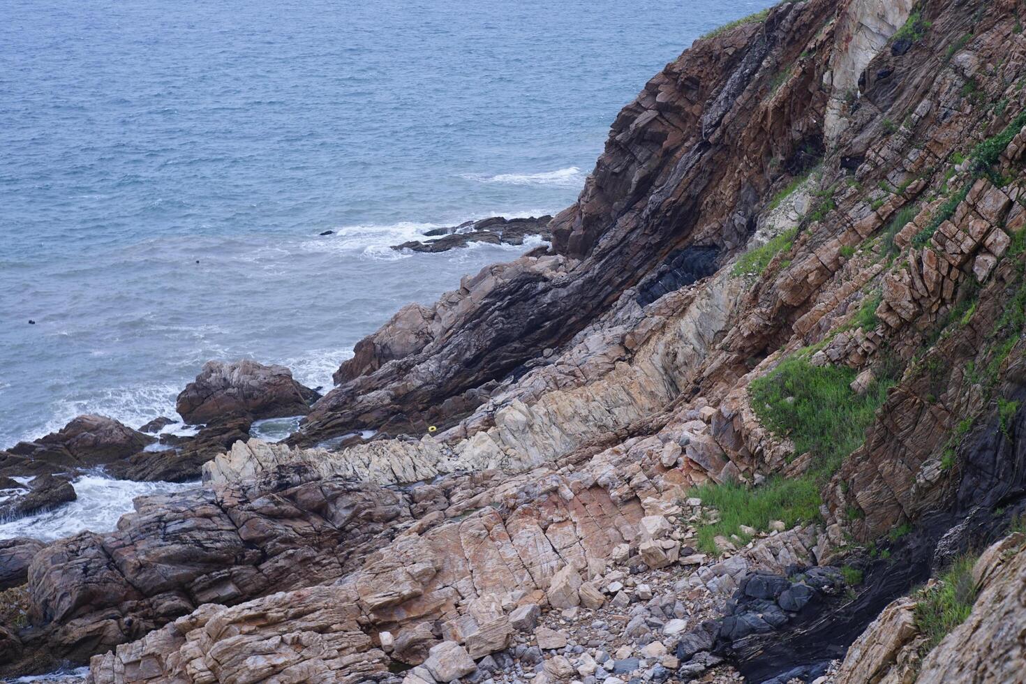Cliffs and waves by the seaside photo