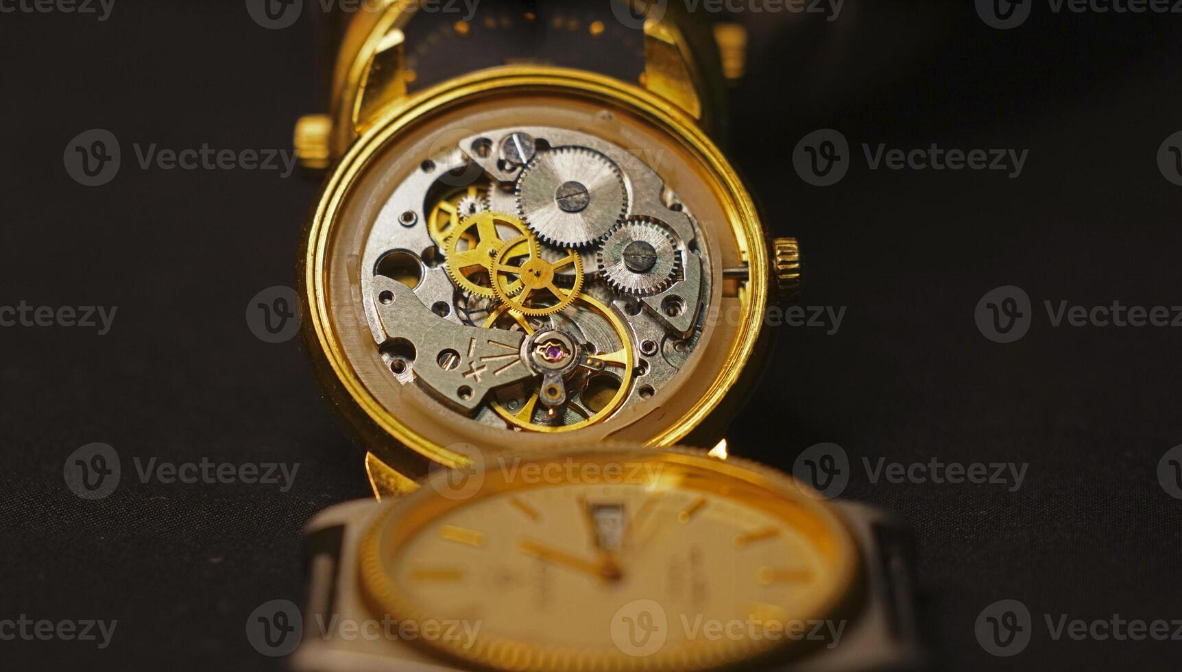 Old golden mechanical watch photo