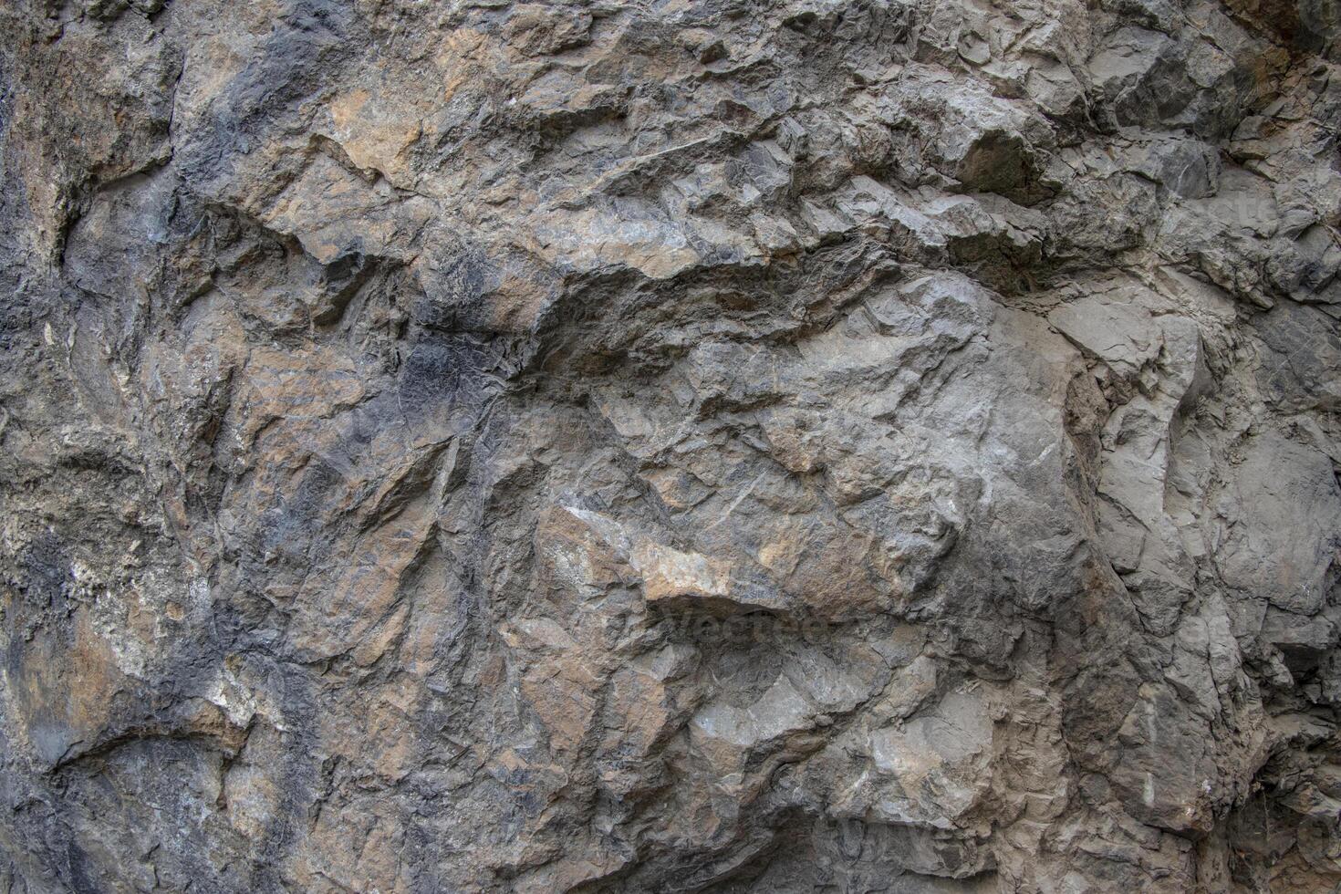 Rough rock and stone surface texture photo