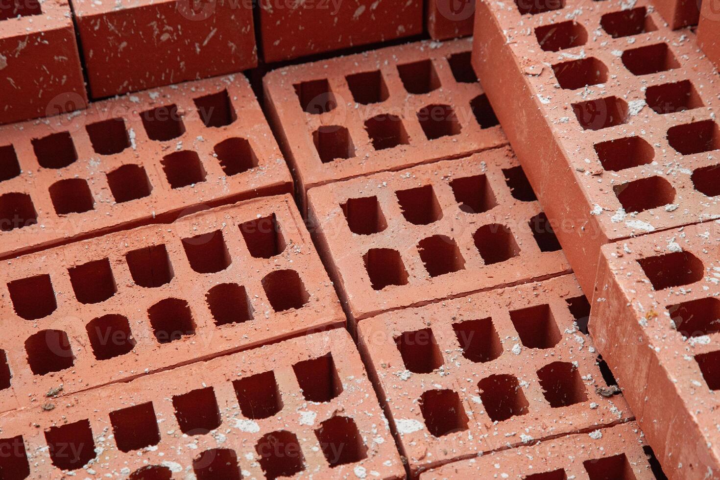 Stacked bricks ready for construction, symbolizing progress and development in the building industry. photo