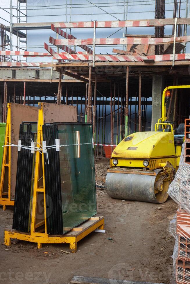Powerful construction compactor at work, shaping the foundation with precision. Essential equipment for building projects. photo