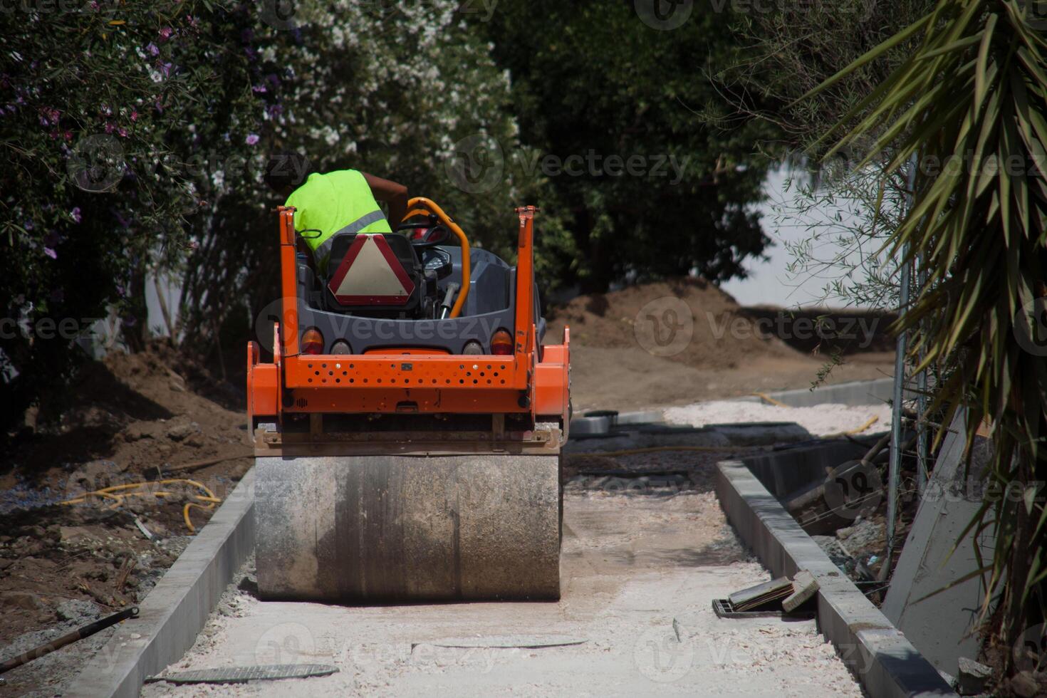 Powerful construction compactor at work, shaping the foundation with precision. Essential equipment for building projects. photo