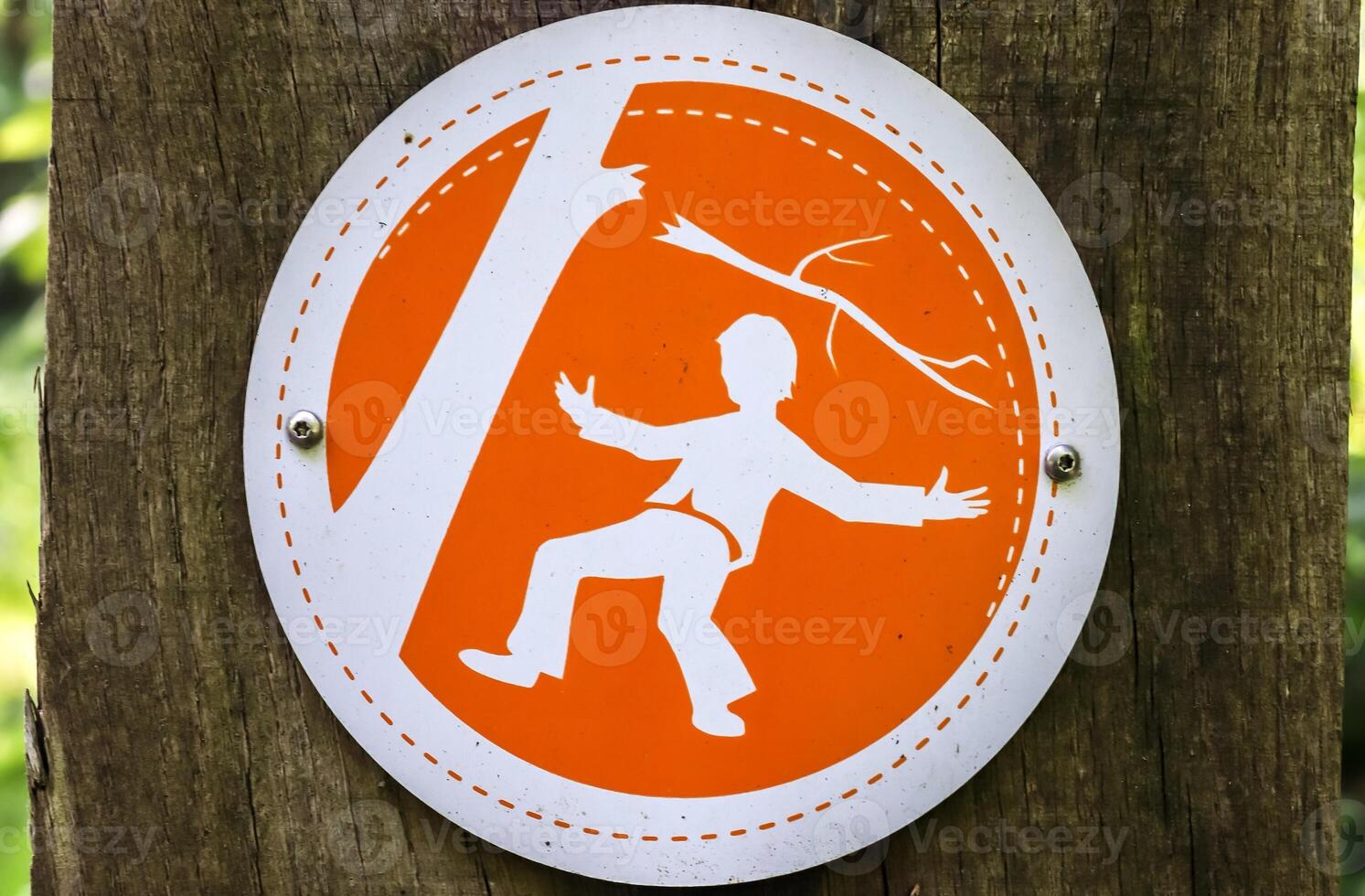 Sign warning of falling branches from trees in a german forest photo