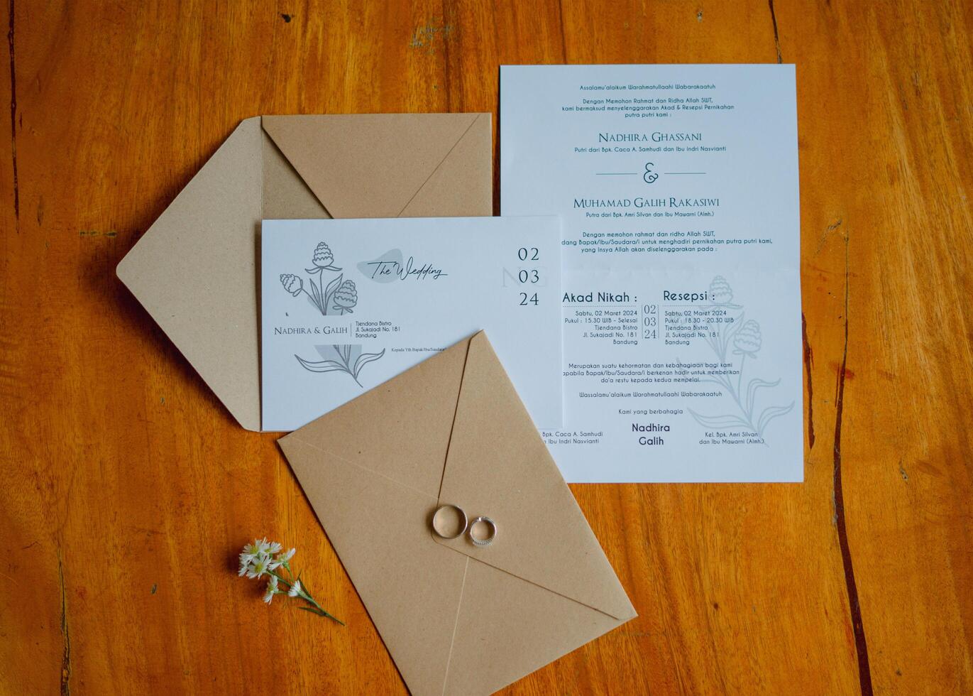 brown and white wedding invitation with couple rings for the bride and groom at the wedding photo