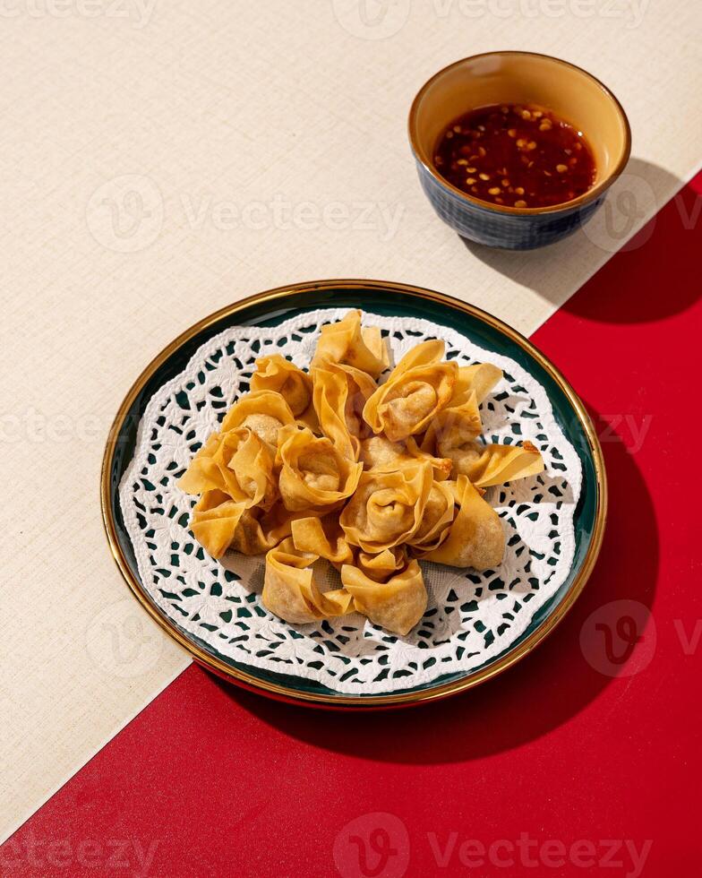 Mini Dumplings are a traditional Chinese food in the form of minced meat wrapped in a sheet of fried wheat flour photo