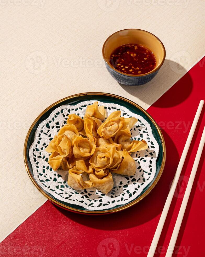 Mini Dumplings are a traditional Chinese food in the form of minced meat wrapped in a sheet of fried wheat flour photo