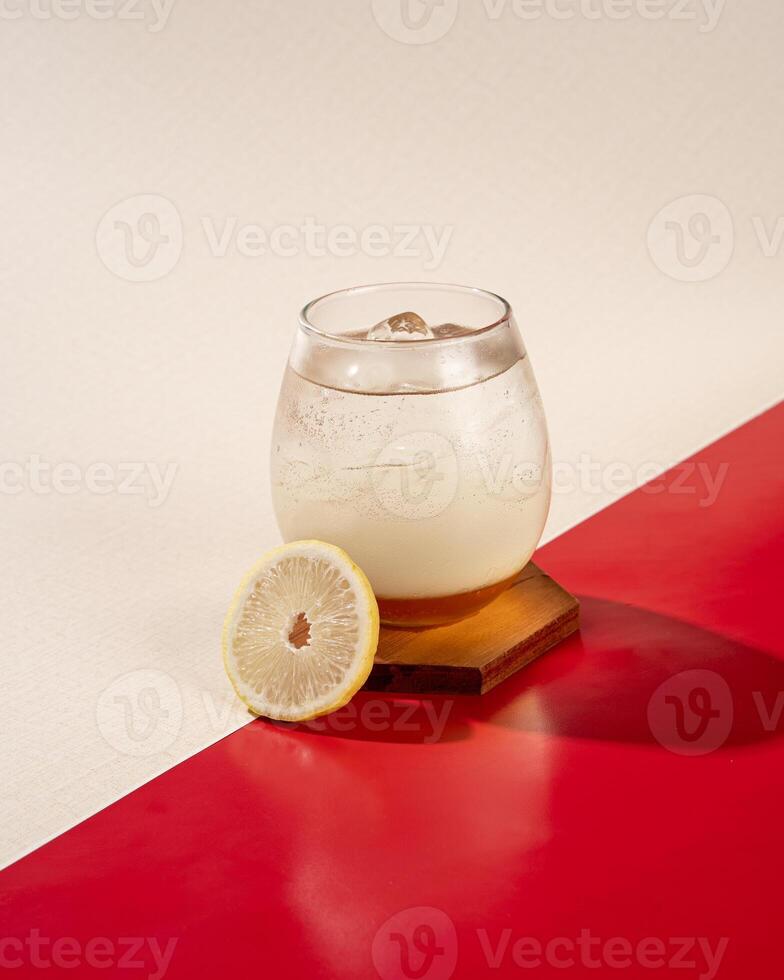 Lemon honey ice is a mixture of mineral water with lemon juice and honey photo