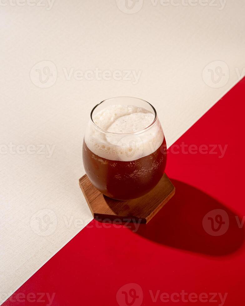 Iced tea is a tea drink that is served cold with ice cubes or you can add lychees photo