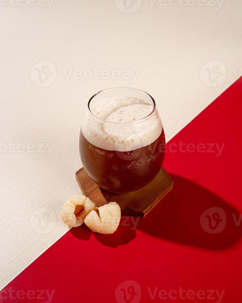 Iced tea is a tea drink that is served cold with ice cubes or you can add lychees photo
