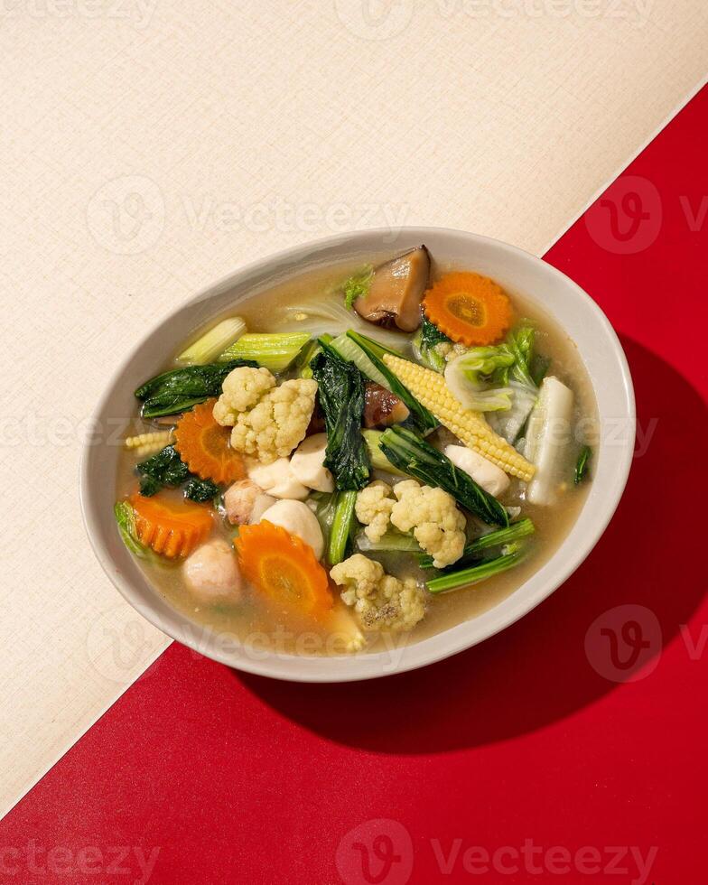 Capcai or capcay is the name of a typical Chinese-Indonesian dish in the form of many kinds of vegetables cooked by boiling or stir-frying. photo