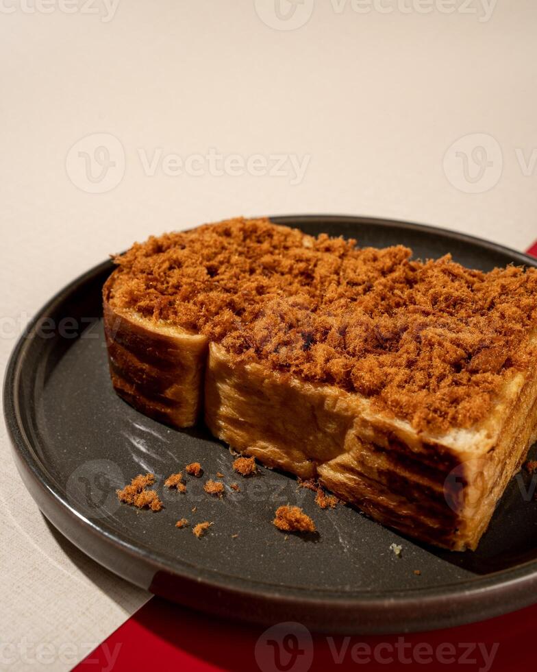 Roti Bakar is a typical grilled Indonesian sandwich, consisting of two slices of bread and a filling of shredded beef photo