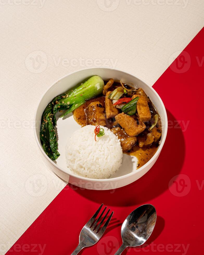 rice served with gourami fish and tausi tofu photo