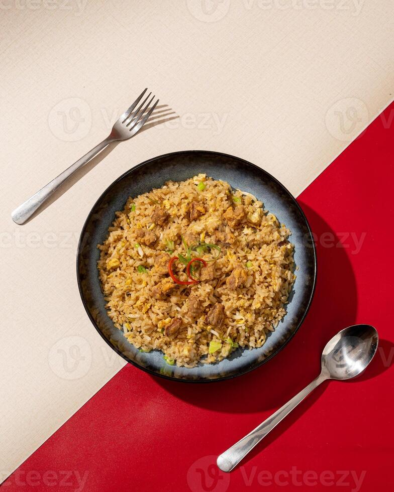 Beef fried rice is a dish of rice fried in a pan which produces a different taste because it is mixed with spices and beef. photo