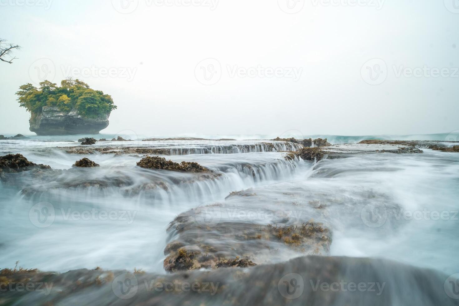 seascape is very beautiful with coral rocks and sea water that looks very soft like cotton. slow shutter speed effect photo