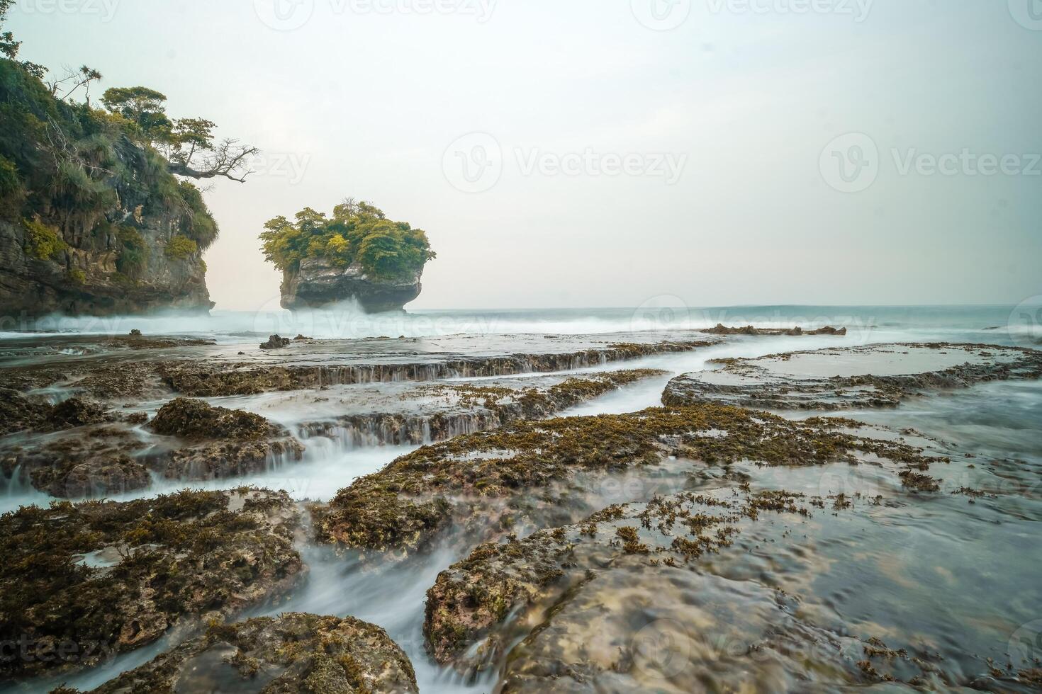 seascape is very beautiful with coral rocks and sea water that looks very soft like cotton. slow shutter speed effect photo