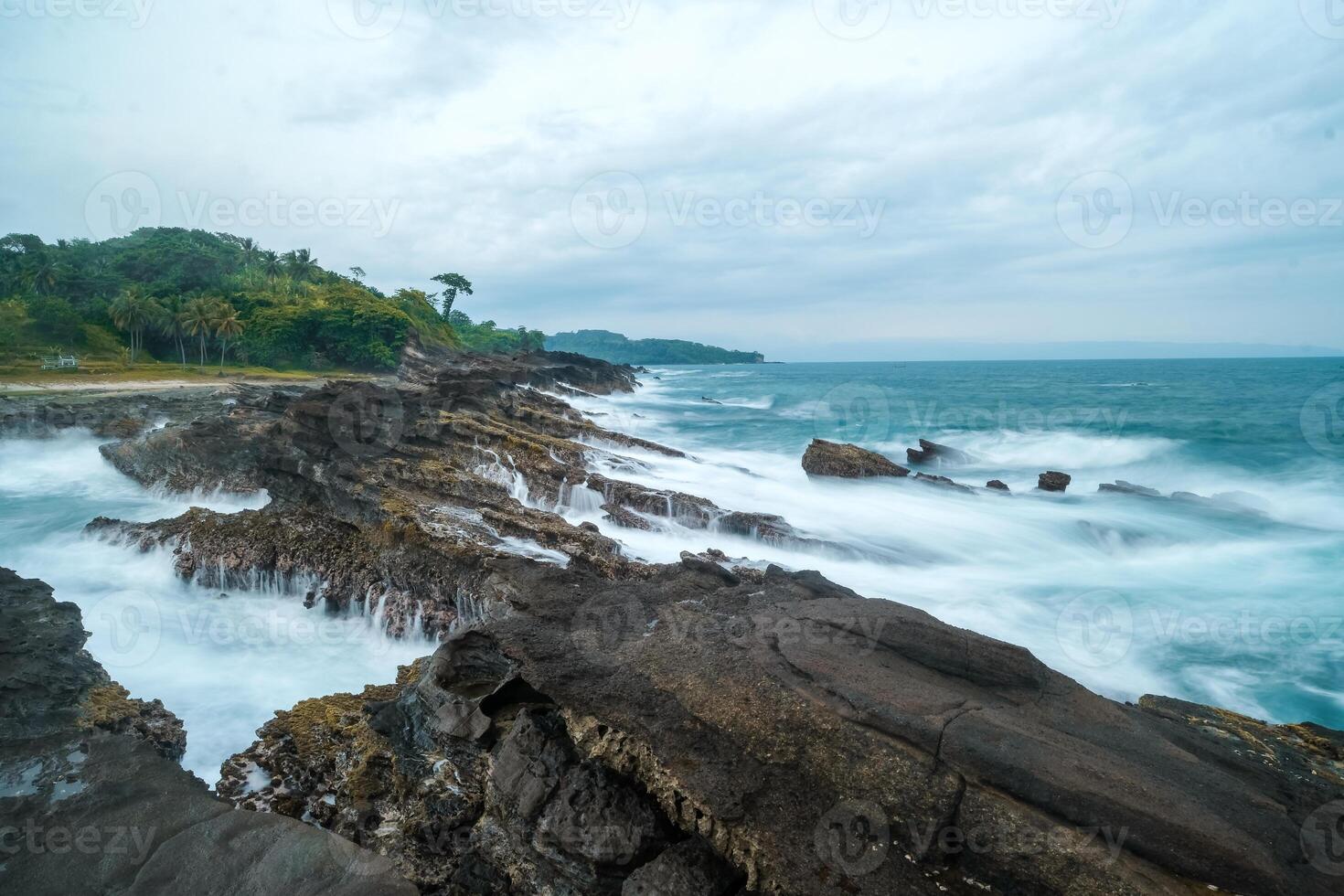 seascape is very beautiful with coral rocks and sea water that looks very soft like cotton. slow shutter speed effect photo