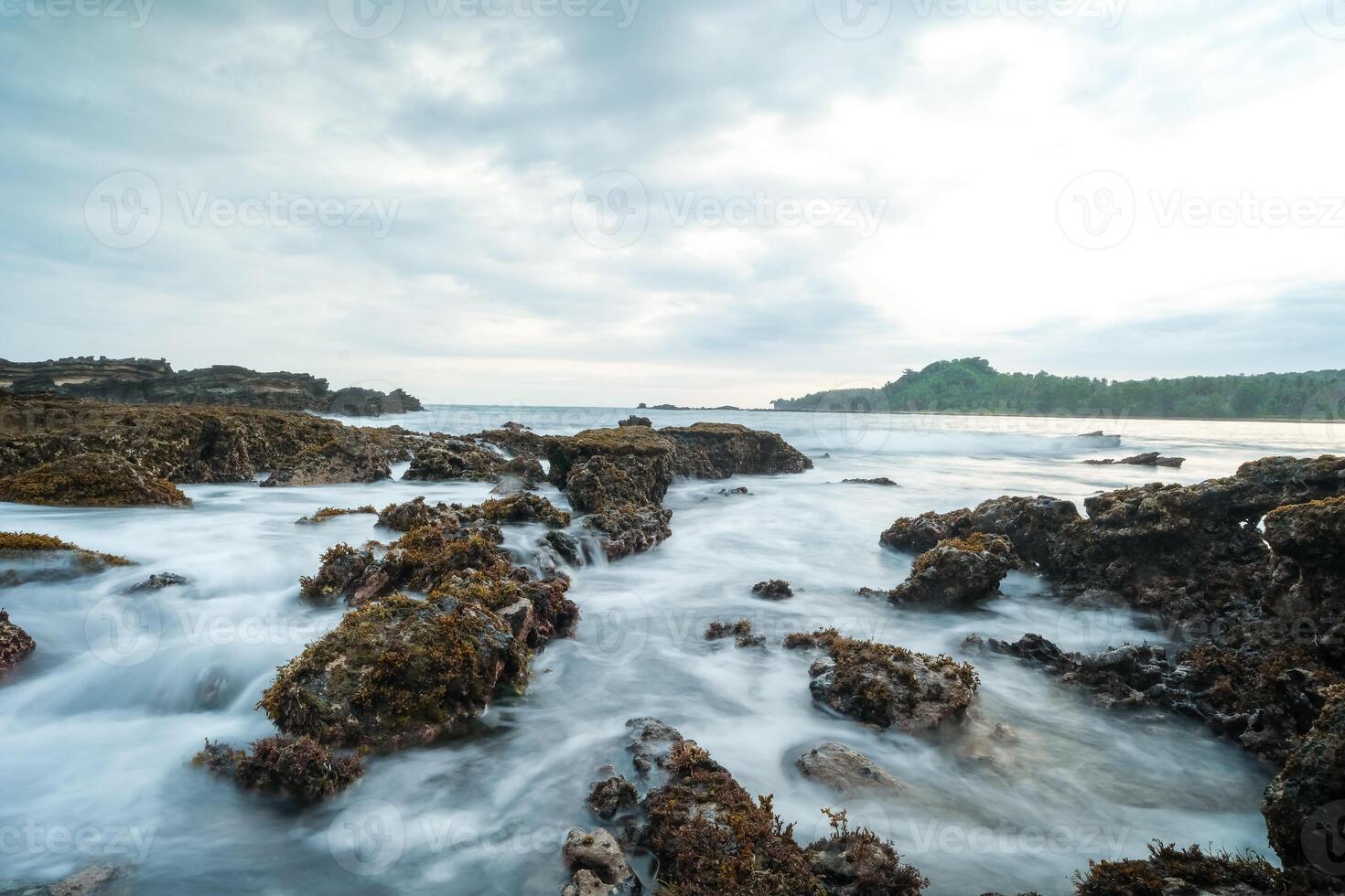 seascape is very beautiful with coral rocks and sea water that looks very soft like cotton. slow shutter speed effect photo