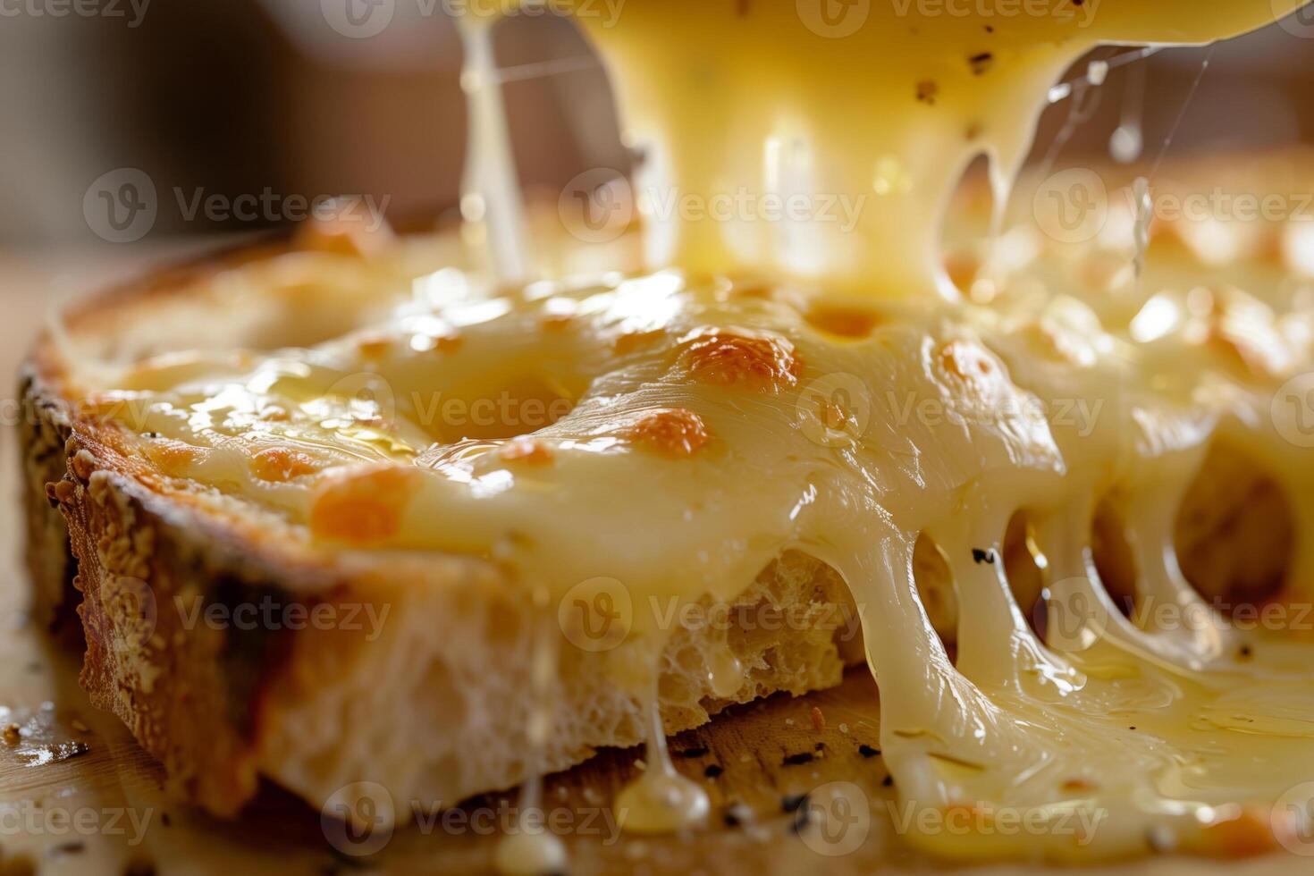 Close-up of melted cheese on toasted bread, showcasing a delicious and gooey texture perfect for food lovers. photo