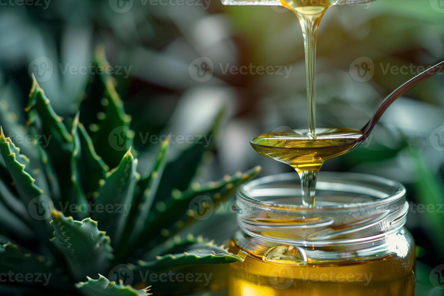 A close-up shot of agave syrup flowing from a spoon into a glass jar, set against a backdrop of lush green foliage. photo