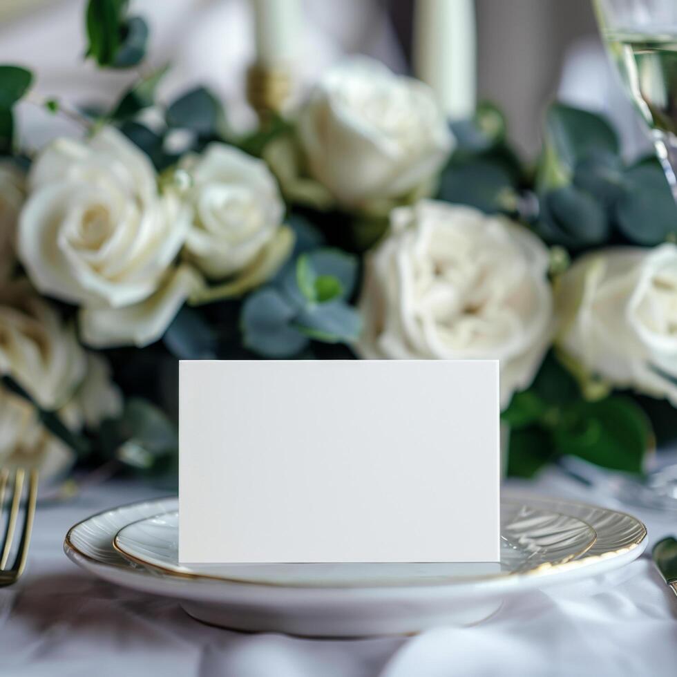Elegant blank place card on a table setting with white roses, suitable for weddings, events or celebratory occasions. photo