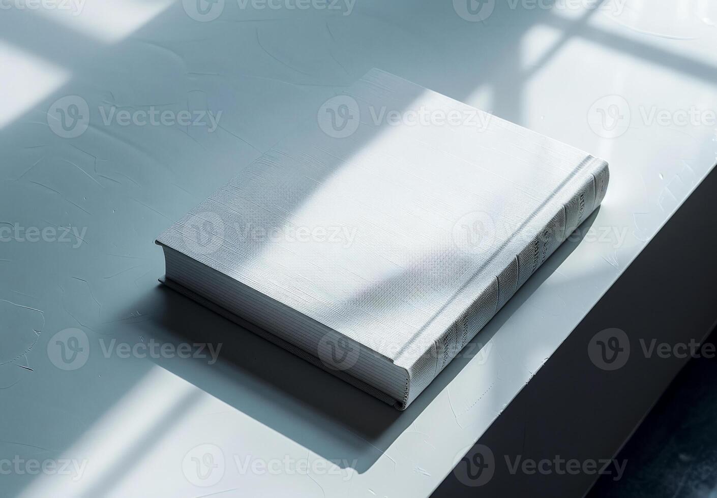 Minimalist White Hardcover Book on Sunlit Table photo