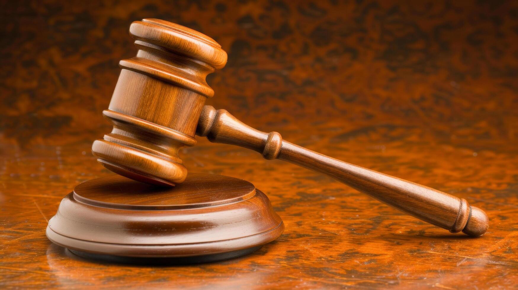 Wooden gavel and sound block on a polished wooden surface. Symbol of justice, authority, and decision-making in the legal system. photo