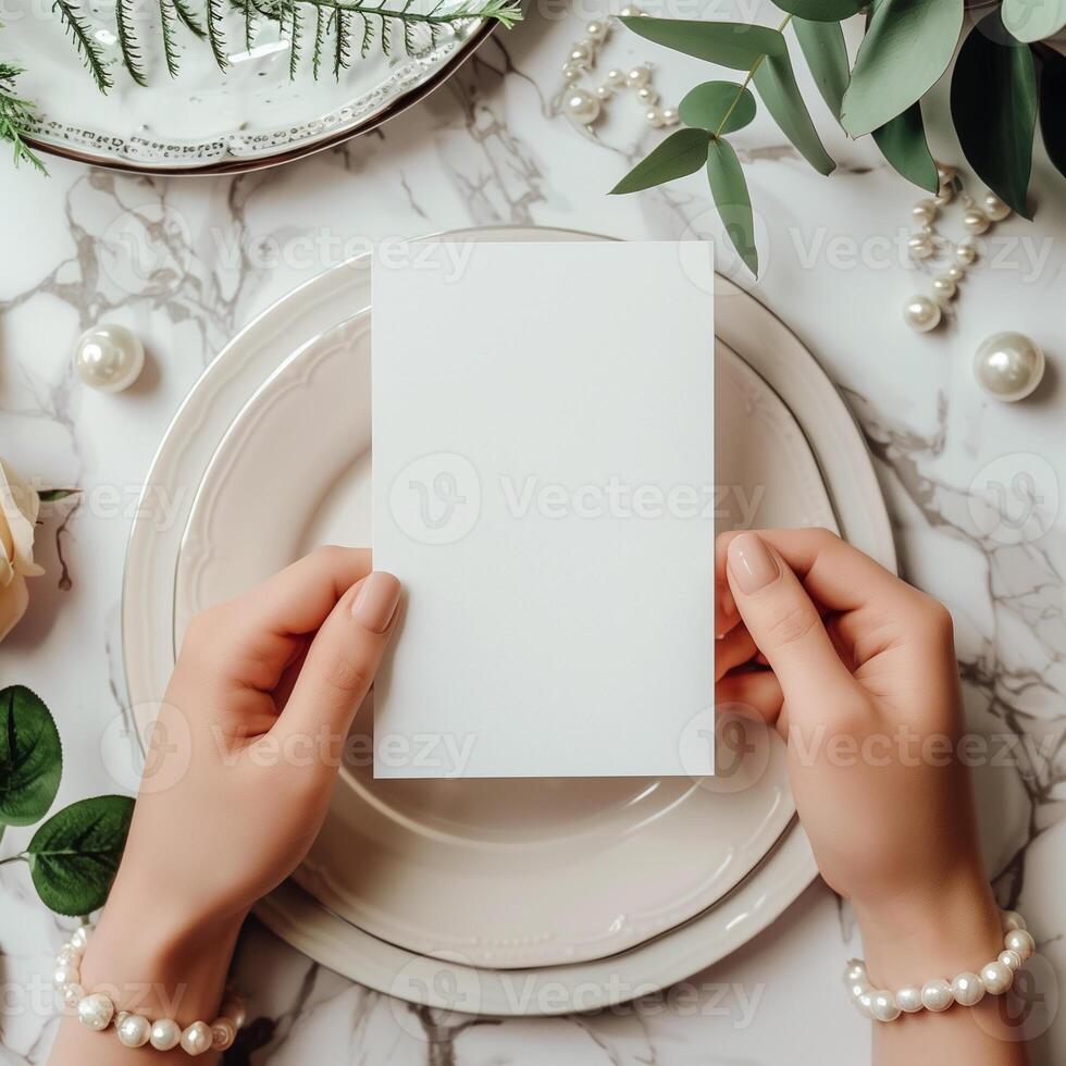 The photo shows a person holding a blank card. The card can be used to write a message or to display a photo.